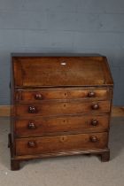 George III mahogany bureau, the sloping fall enclosing a pigeon holed interior and drawers, fitted