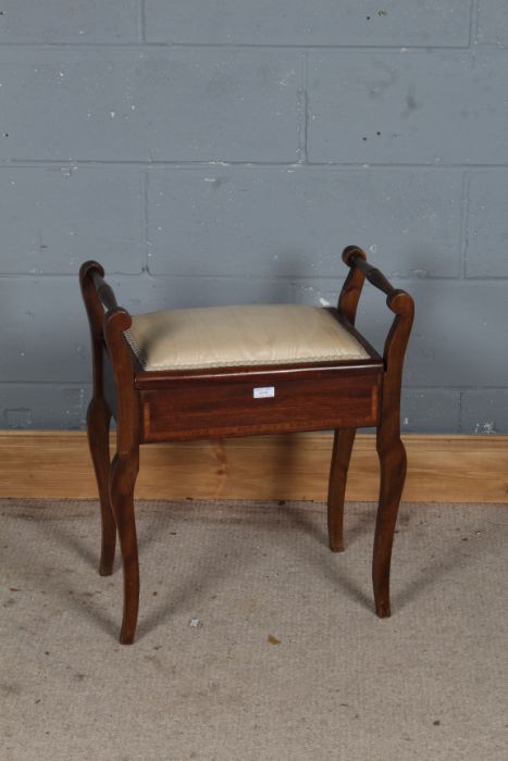 Edwardian mahogany inlaid piano stool, the hinged seat enclosing music books, raised in cabriole