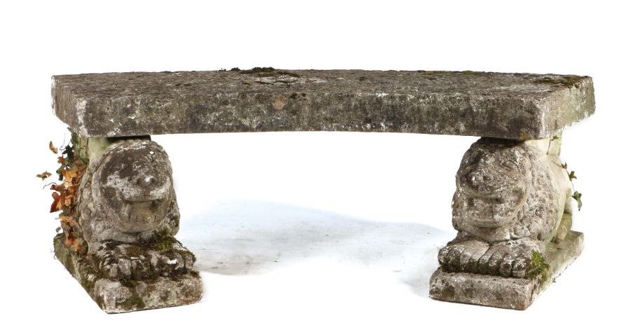 Danish composite stone bench, the arched plinth seat above two stylised lions on plinth bases, 122cm