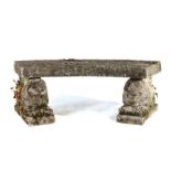 Danish composite stone bench, the arched plinth seat above two stylised lions on plinth bases, 122cm