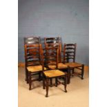 Matched set of six 19th Century ladder back dining chairs, to include two armchairs and four