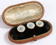 Three 18ct gold buttons with turquoise and mother of pearl. Weighing 5.7 grams. Encased in a leather