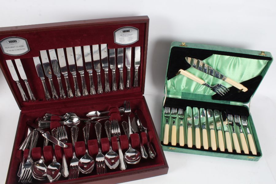 Collection of silver plated cutlery housed within two canteens