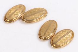 A pair of 9 carat yellow gold oval cuff-links. Approx. measurements 19 x 11mm. Weighing 2.80 grams.