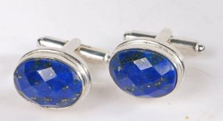 A pair of silver cuff-links set with Lapis Lazuli. Approx. measurements 15.50 x 12mm. Weighing 11