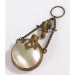 Mother of pearl and brass scent bottle, the bottle of circular form with brass decoration