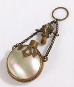 Mother of pearl and brass scent bottle, the bottle of circular form with brass decoration