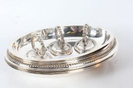 Set of three silver plated chafing dishes and covers, the beaded and foliate cast detachable handles