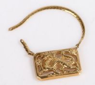 A 9ct yellow gold dragon pendant with chain AF. Weighing 5.1 grams.