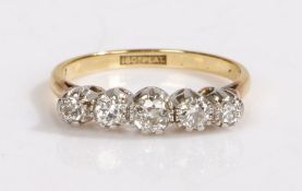An 18ct yellow gold ring set with five diamonds. Approx. total diamond carat weight: 0.50cts.