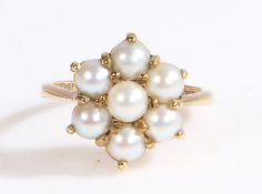 A 9ct yellow gold pearl cluster ring. Approx. diameter of pearls: 4.00mm. Ring size N. Weighing 3.80