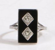 An art deco white metal rectangular onyx and diamond set ring. Total approx. diamond carat weight