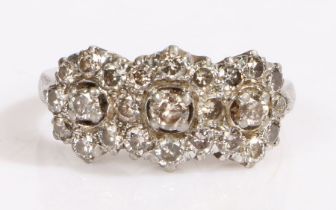 A white Indian metal diamond cluster three flower ring. Approx. total diamond carat weight: 1.05cts.