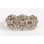 A white Indian metal diamond cluster three flower ring. Approx. total diamond carat weight: 1.05cts.