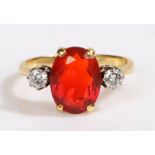 An 18ct yellow gold fire opal and diamond trilogy ring. Approx. fire opal carat weight: 2.20cts.