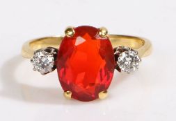 An 18ct yellow gold fire opal and diamond trilogy ring. Approx. fire opal carat weight: 2.20cts.