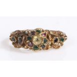 An antique yellow metal ring set with diamonds, emeralds, sapphires and rubies. Encased in a Richard