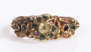 An antique yellow metal ring set with diamonds, emeralds, sapphires and rubies. Encased in a Richard