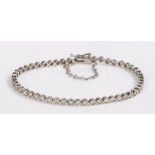 An 18ct white gold diamond tennis bracelet. Approx. total diamond carat weight: 2.00cts. Colour: H-