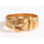 An 18ct yellow gold buckle ring. Width of buckle: 8.60mm.  Ring size K. Weighing 3.70 grams. Used,