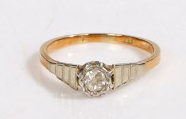 An 18ct yellow gold and platinum diamond solitaire ring. Approx. diamond carat weight: 0.16cts.