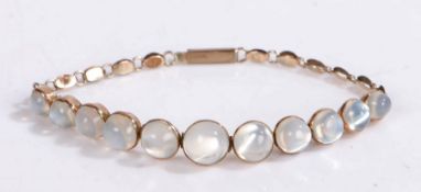 A 9ct rose gold bracelet set with eleven moonstone cabochons in a graduating order. Approx. length
