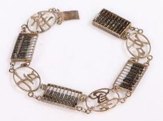 A 14ct gold Chinese bracelet with four abacus' with miniature wooden beads and four character links.