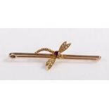 A 9ct yellow gold dragonfly brooch, with garnets for the body and pearls for the wings. Length 54mm.