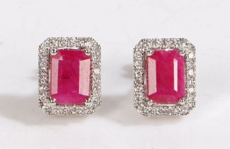 A pair of 18ct white gold ruby and diamond cluster earrings. Approx. measurements of rubies: 7 x