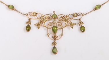 A vintage 9ct yellow gold peridot and seed pearl floral necklet. Approx. length 43cm. Weighing 7.