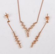 An 18ct rose gold 'V' shaped necklace set with diamonds and a matching pair of earrings. Approx.