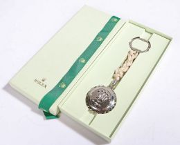 Rolex keyring, the crown and Rolex engraved split ring above a knotted rope centre and pendant in