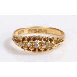 An 18ct yellow gold ring with five diamonds. Approx. total diamond carat weight: 0.08cts. Colour J-