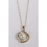 A 9ct yellow and white gold pearl and diamond pendant, suspended from a 9ct yellow gold chain.