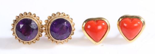 A pair of 9ct yellow gold heart shaped stud earrings set with coral.  Measurements: 9.5 x 9.8mm.