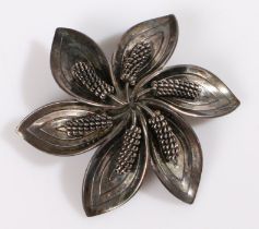 A sterling silver Danish flower brooch by Aarre and Krogh. The pin is missing. Stamped 925 Danish