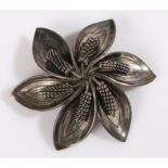 A sterling silver Danish flower brooch by Aarre and Krogh. The pin is missing. Stamped 925 Danish