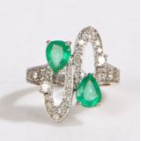 An 18ct gold ring with pear cut emeralds and diamonds. Approx. total emerald carat weight: 1.