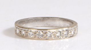 A platinum diamond set half eternity ring. Approx. total diamond carat weight: 0.27cts. Colour: G-H.