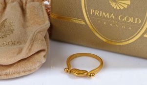 A 24ct yellow gold swivel heart ring by PrimaGold. With paperwork and a bag from PrimaGold. Ring