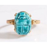 A 9ct yellow metal carved blue scarab beetle ring.  Approx. 13.5 x 10mm. Ring size P. Weighing 2.