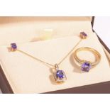 A pair of 14ct yellow gold tanzanite stud earrings. Carat weight: 1.23cts. Weighing 1.28 grams. A