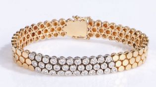 A 14ct yellow and white gold bracelet set with diamonds. Approx. total diamond carat weight: 1.