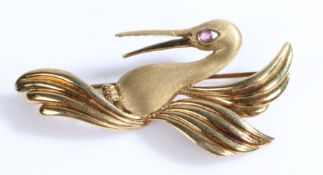 A 9ct yellow gold swan brooch, set with one ruby for an eye. Measurements: 55 x 22mm. Weighing 4.