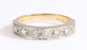 An 18ct yellow gold and platinum diamond set half eternity ring. Approx. total diamond carat weight: