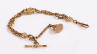 A 9ct yellow gold pocket watch chain with a fob and t-bar, and a twisted clip with a double row of