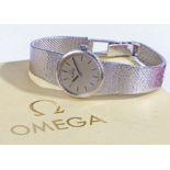 Omega 9 carat white gold ladies wristwatch, circa 1977, the signed silver dial with baton markers,