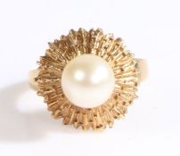 A 14ct yellow gold Mikimoto pearl ring with a bark textured halo. 1 x creamy white pearl with very