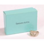 A sterling silver Tiffany & Co. three band interlocking ring, with bag and box. Ring size H.