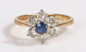 A 9ct gold sapphire and diamond cluster ring. Approx. carat weight of sapphire: 0.30cts. Total